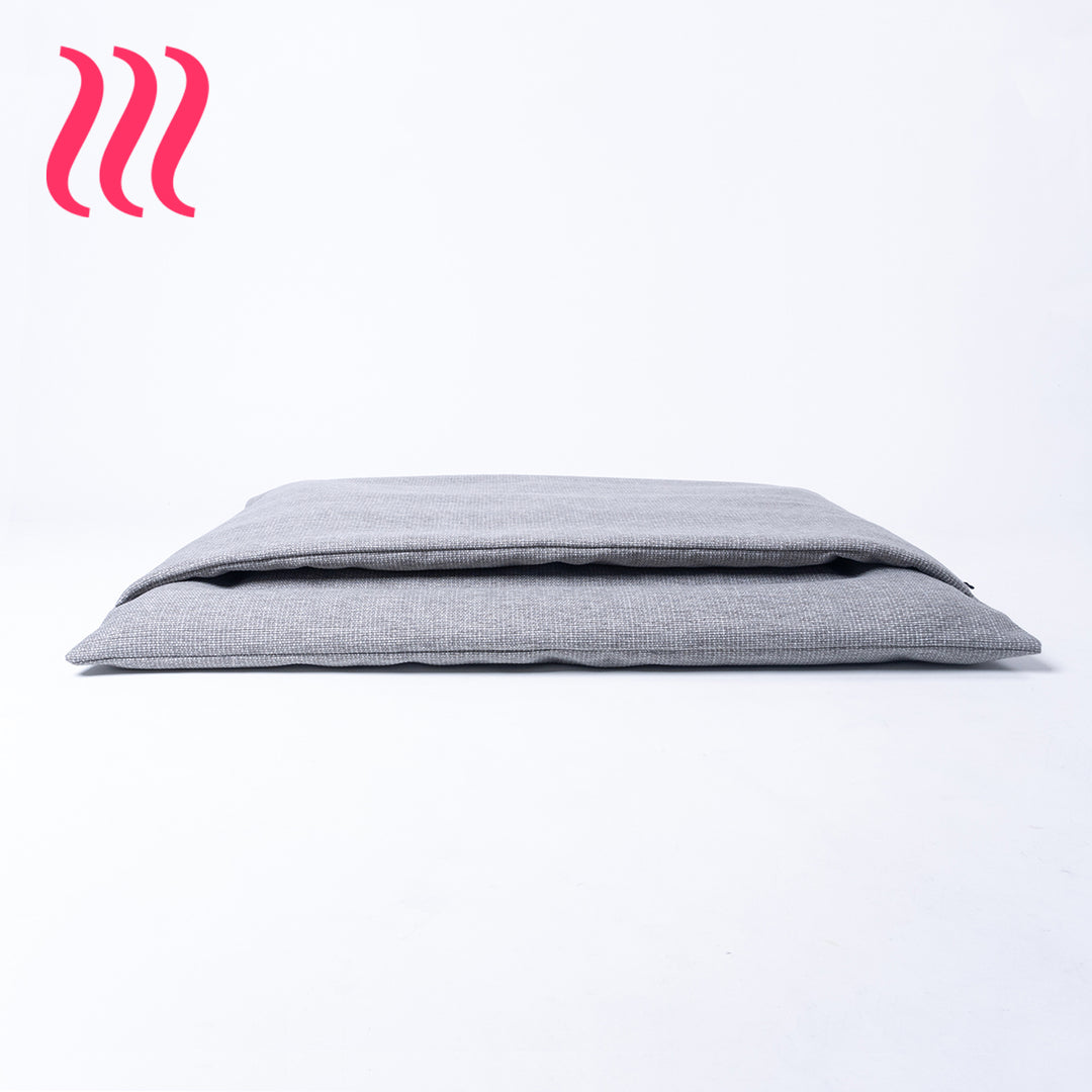 Front profile view of a luxury sleeping bag style dog burrow bag by Charley Chau in a grey woven upholstery fabric on a white background.