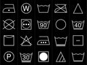 A selection of 20 common wash care symbols laid out in a grid structure on a black background 