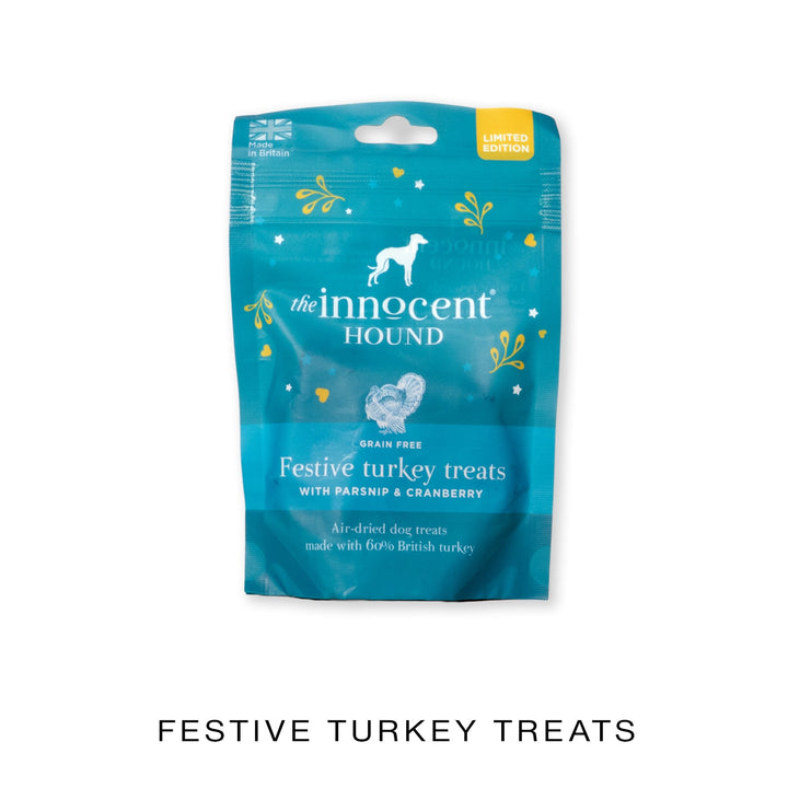Blue festive package of 'The Innocent Hound' festive turkey treats on a white background