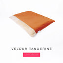 Luxury Dog Burrow Bag, a sleeping bag style or snuggle sack style dog bed, with a bright orange Velour outer cover and a plush cream faux-fur lining on a white backdrop.