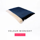 Luxury Dog Burrow Bag, a sleeping bag style or snuggle sack style dog bed, with a dark navy blue Velour outer cover and a plush cream faux-fur lining on a white backdrop.