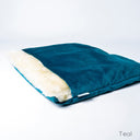 Luxury Dog Burrow Bag in Teal Velour - a sleeping bag dog bed with a built-in cover for a dog to sleep covered up.