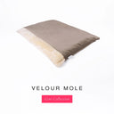 Luxury Dog Burrow Bag, a sleeping bag style or snuggle sack style dog bed, with a warm taupe grey Velour outer cover and a plush cream faux-fur lining on a white backdrop.