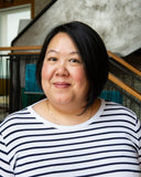Jenny Chau, co-founder of Charley Chau wearing a black and white stripey t-shirt.