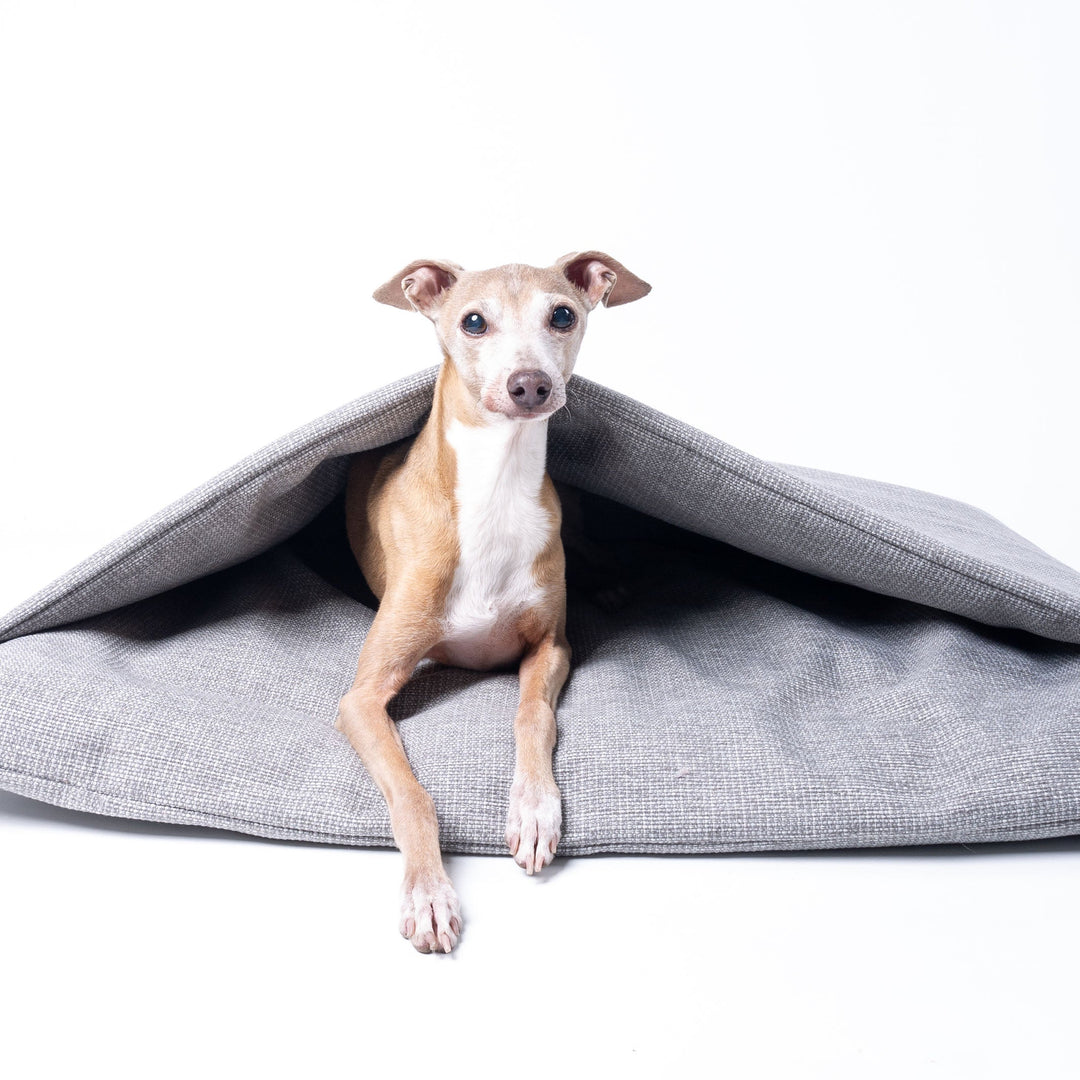 A Dog Burrow Bag, a snuggle sack style dog bed in Weave II fabric, colour Heron Grey.