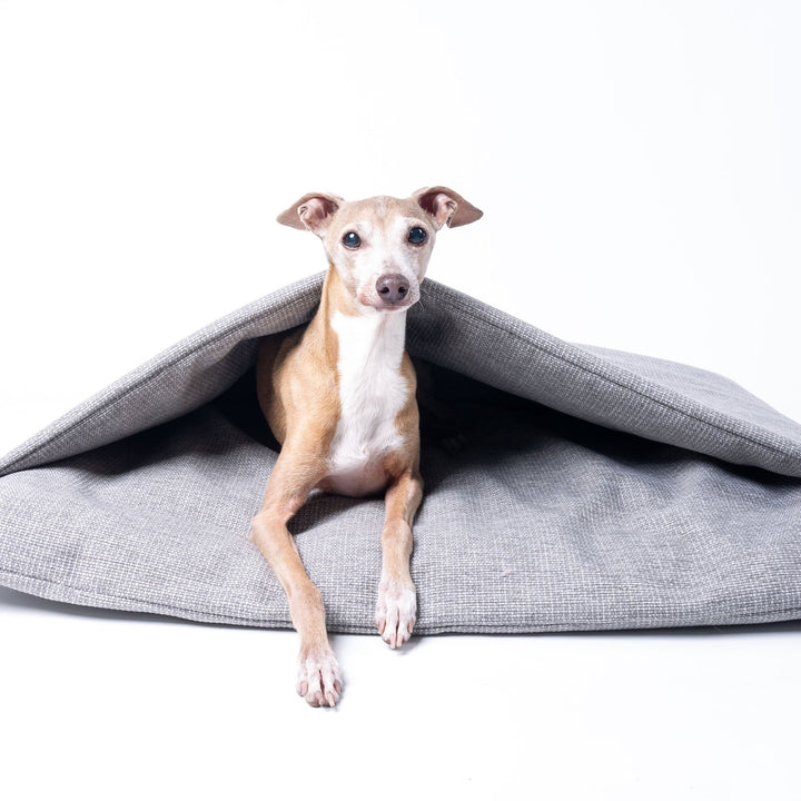 A Dog Burrow Bag, a snuggle sack style dog bed in Weave II fabric, colour Heron Grey.