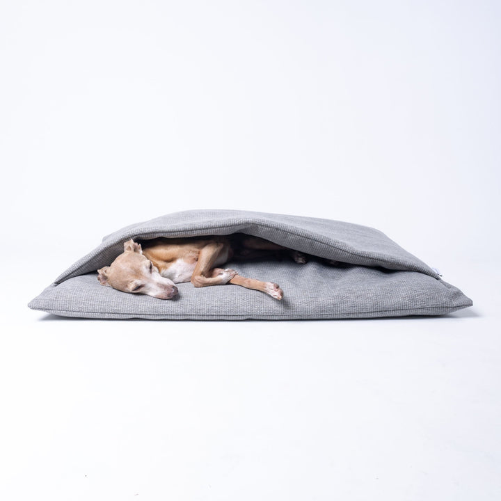 A Dog Burrow Bag, a snuggle sack style dog bed in Weave II fabric, colour Heron Grey.