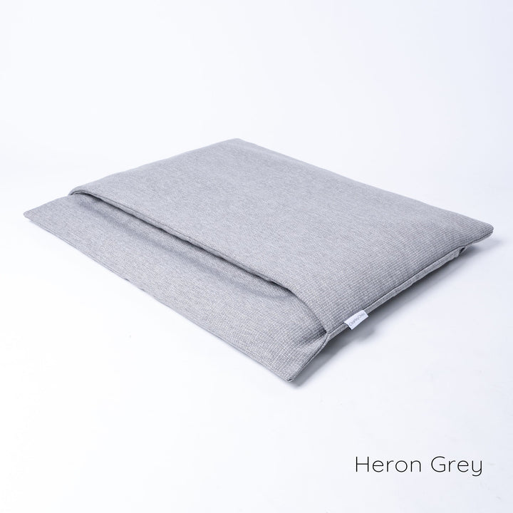 Dog Burrow Bag by designers Charley Chau, a dog sleeping bag style dog bed in Weave II fabric, colour Heron Grey.
