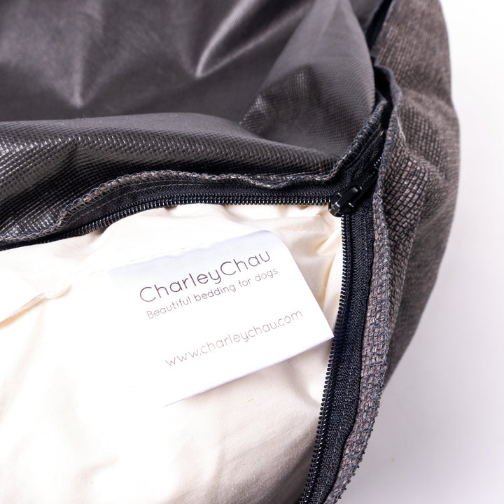 Close up of the feather pads that fill he sides of the luxury donut dog bed by designer Charley Chau - the Ducky Donut Dog Bed.