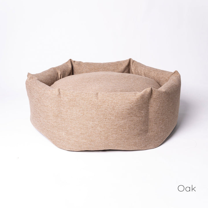 Luxury donut dog bed by designer Charley Chau - the Ducky Donut Dog Bed, shown here in a warm neutral Oak.