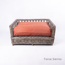 Luxury wicker dog bed - Charley Chau's Raised Rattan Dog Bed - with a deep-filled dog bed mattress in sienna orange, placed on a white background.