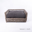Luxury wicker dog bed - Charley Chau's Raised Rattan Dog Bed - with a dark brown/black deep-filled dog bed mattress, placed on a white background.