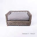 Luxury wicker dog bed - Charley Chau's Raised Rattan Dog Bed - with a grey deep-filled dog bed mattress, placed on a white background.