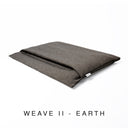 Luxury dog burrow bag, a snuggle bag style dog bed, in a woven dark brown upholstery fabric, labelled with "Weave II - Earth" text on a white background.