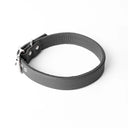 A handcrafted, bespoke DARK GREY  dog collar in a classic cut, made to order with finest quality Italian Calf Leather, to fit all breeds and sizes of dog, on a white background. Handcrafted by Petiquette Collars in England for a quality dog collar that is made to last. 
