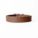 A handcrafted, bespoke brown leather dog collar in a classic cut, made to order with finest quality Italian Calf Leather, to fit all breeds and sizes of dog, on a white background.