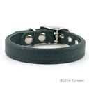 A Classic style dog collar made from calf leather shown in the colour Bottle Green on a white backdrop. Handmade to order. 