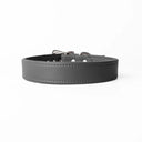 A handcrafted, bespoke DARK GREY  dog collar in a classic cut, made to order with finest quality Italian Calf Leather, to fit all breeds and sizes of dog, on a white background. Handcrafted by Petiquette Collars in England for a quality dog collar that is made to last. 