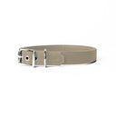 A handcrafted, bespoke pale beige leather dog collar in a classic cut, made to order to fit all breeds and sizes of dog, on a white background.