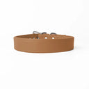 A handcrafted, bespoke TAN leather dog collar in a classic cut, made to order with finest quality Italian Calf Leather, to fit all breeds and sizes of dog, on a white background. Handcrafted by Petiquette Collars in England for a quality dog collar that is made to last. 
