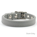 A Classic style dog collar made from calf leather shown in the colour Dove Grey on a white backdrop. Handmade to order. 
