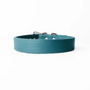 A handcrafted, bespoke TEAL leather dog collar in a classic cut, made to order with finest quality Italian Calf Leather, to fit all breeds and sizes of dog, on a white background. Handcrafted by Petiquette Collars in England for a quality dog collar that is made to last. 