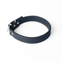 A close-up of a bespoke dark blue  leather dog collar with visible stitching, made with fine Italian Calf leather, labelled 'MADEIRA BLUE' below on a white background.