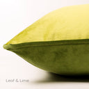 Closeup of a two-toned machine washable velvet dog bed in green on a white background, Leaf & Lime.
