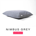 A luxury machine washable dog bed mattress in a grey upholstery fabric with 'NIMBUS GREY' and a pink 'Core Collection' label on a white background.