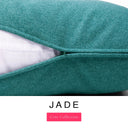 Close-up of a deep teal green machine washable dog bed mattress with its removable cover partially unzipped, revealing the deep-filled luxury dog bed mattress inside, above a white banner with the text 'JADE' and 'Core Collection'.