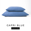Two luxury dog bed mattresses in a rich denim blue upholstery fabric stacked on top of each other, with 'CAPRI BLUE' and a black 'Styled To Order' label on a white background; these machine washable dog bed mattresses are made for lasting comfort and easy care.
