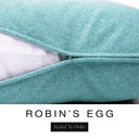 Close-up of a soft powder blue machine washable dog bed mattress with its removable cover partially unzipped, revealing the deep-filled luxury dog bed mattress inside, above a white banner with the text 'ROBIN'S EGG' and 'Styled To Order'.