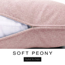 Close-up of a soft blush pink machine washable dog bed mattress with its removable cover partially unzipped, revealing the deep-filled luxury dog bed mattress inside, above a white banner with the text 'SOFT PEONY' and 'Styled To Order'.