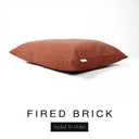 A luxury dog bed mattress in a warm terracotta orange-red upholstery fabric with 'FIRED BRICK' and a black 'Styled To Order' label on a white background; this machine washable dog bed mattress is designed for everyday comfort.
