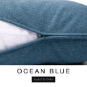 Close-up of a deep petrol blue machine washable dog bed mattress with its removable cover partially unzipped, revealing the deep-filled luxury dog bed mattress inside, above a white banner with the text 'OCEAN BLUE' and 'Styled To Order'.