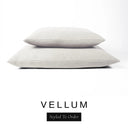 Two luxury dog bed mattresses in a soft off-white cream upholstery fabric stacked on top of each other, with 'VELLUM' and a black 'Styled To Order' label on a white background; these machine washable dog bed mattresses are made for lasting comfort and easy care.