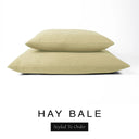 Two luxury dog bed mattresses in a warm golden oat upholstery fabric stacked on top of each other, with 'HAY BALE' and a black 'Styled To Order' label on a white background; these machine washable dog bed mattresses are made for lasting comfort and easy care.