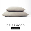Two luxury dog bed mattresses in a warm sandy taupe upholstery fabric stacked on top of each other, with 'DRIFTWOOD' and a black 'Styled To Order' label on a white background; these machine washable dog bed mattresses are made for lasting comfort and easy care.