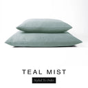 Two luxury dog bed mattresses in a muted sage teal upholstery fabric stacked on top of each other, with 'TEAL MIST' and a black 'Styled To Order' label on a white background; these machine washable dog bed mattresses are made for lasting comfort and easy care.