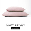 Two luxury dog bed mattresses in a soft blush pink upholstery fabric stacked on top of each other, with 'SOFT PEONY' and a black 'Styled To Order' label on a white background; these machine washable dog bed mattresses are made for lasting comfort and easy care.