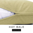 Close-up of a warm golden oat machine washable dog bed mattress with its removable cover partially unzipped, revealing the deep-filled luxury dog bed mattress inside, above a white banner with the text 'HAY BALE' and 'Styled To Order'.