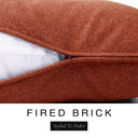 Close-up of a warm terracotta orange-red machine washable dog bed mattress with its removable cover partially unzipped, revealing the deep-filled luxury dog bed mattress inside, above a white banner with the text 'FIRED BRICK' and 'Styled To Order'.