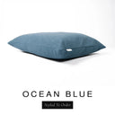 A luxury dog bed mattress in a deep petrol blue upholstery fabric with 'OCEAN BLUE' and a black 'Styled To Order' label on a white background; this machine washable dog bed mattress is designed for everyday comfort.