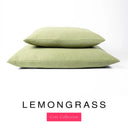 Two luxury machine washable dog bed mattresses in a lemongrass yellow upholstery fabric stacked on top of each other with 'LEMONGRASS' and a pink 'Core Collection' label on a white background. 