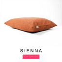 A luxury machine washable dog bed mattress in a sienna orange upholstery fabric with 'SIENNA' and a pink 'Core Collection' label on a white background.