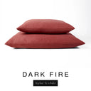 Two luxury dog bed mattresses in a deep rust red upholstery fabric stacked on top of each other, with 'DARK FIRE' and a black 'Styled To Order' label on a white background; these machine washable dog bed mattresses are made for lasting comfort and easy care.