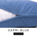 Close-up of a rich denim blue machine washable dog bed mattress with its removable cover partially unzipped, revealing the deep-filled luxury dog bed mattress inside, above a white banner with the text 'CAPRI BLUE' and 'Styled To Order'.