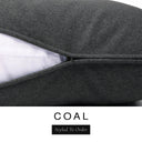Close-up of a dark charcoal black machine washable dog bed mattress with its removable cover partially unzipped, revealing the deep-filled luxury dog bed mattress inside, above a white banner with the text 'COAL' and 'Styled To Order'.