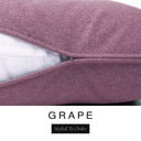 Close-up of a dusky mauve-purple machine washable dog bed mattress with its removable cover partially unzipped, revealing the deep-filled luxury dog bed mattress inside, above a white banner with the text 'GRAPE' and 'Styled To Order'.