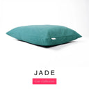 A luxury machine washable dog bed mattress in a jade green / teal upholstery fabric with 'JADE' and a pink 'Core Collection' label on a white background.